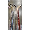 Image 2 : LOT OF HOCKEY STICKS AND HOCKEY STICK SHELF