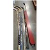 Image 4 : LOT OF HOCKEY STICKS AND HOCKEY STICK SHELF