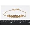 Image 1 : GOLD TONE LEAF DESIGN BRACELET HAS CLEAR