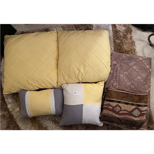 Large Assortment Of Pillows And Blankets