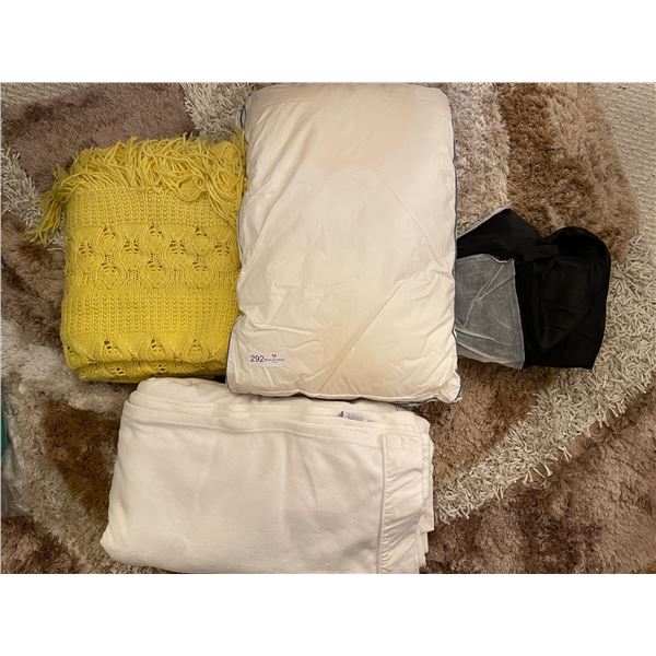 Large Assortment Of Pillows And Blankets