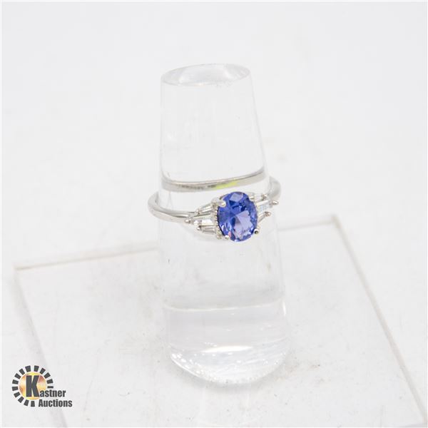 #460-8 X 10 OVAL BLUE CUBIC ZIRCONIA WITH 3 ROUND