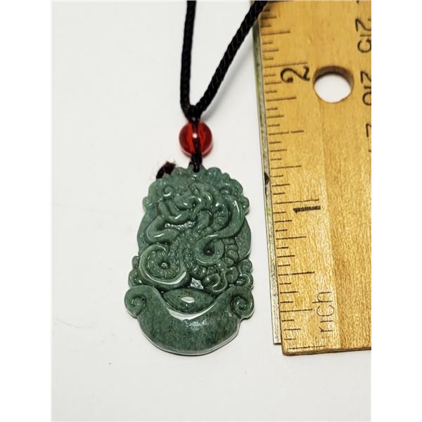 40)  NATURAL GREEN JADEITE SNAKE PENDANT ON SILK