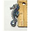 32)  SILVER TONE WITH BLUE IRRIDESCENT CRYSTALS,