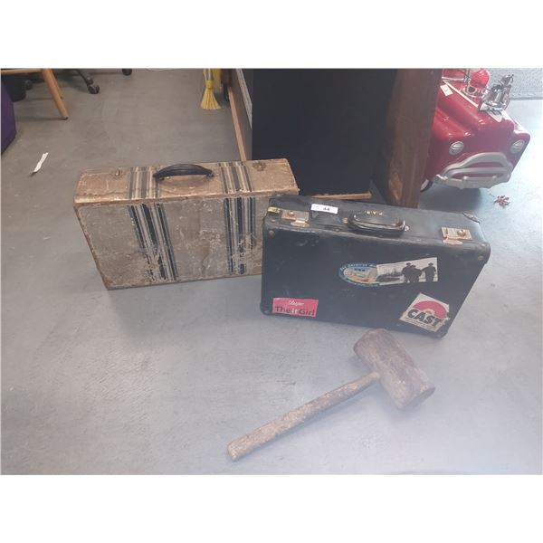 2 suitcases and wooden mallet