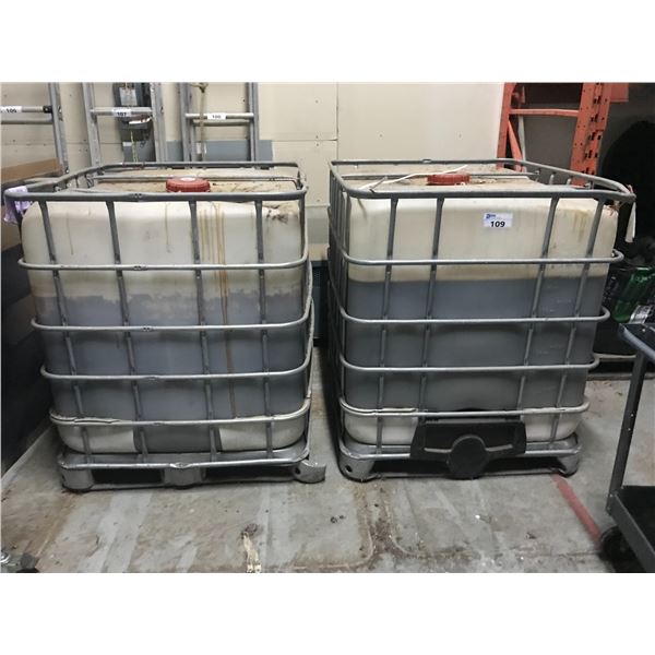 2 LARGE METAL CAGED PLASTIC LIQUID STORAGE CONTAINERS WITH CONTENTS-LIKELY PLANT GROWTH FORMULA??