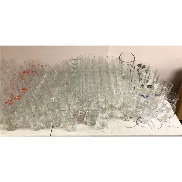 Large group of assorted glasses including - champagne glasses, beer glasses, shot glasses, cups, etc