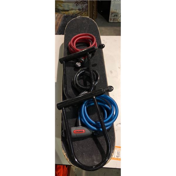 Group of bike locks & skateboard