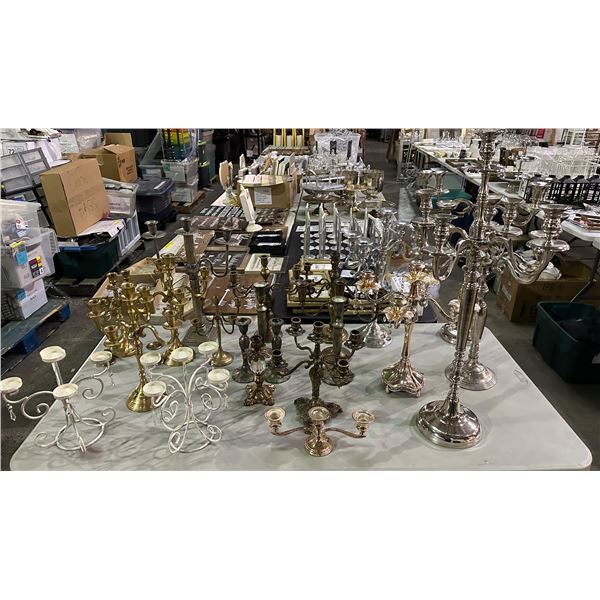Group of assorted various sized candle stick holders