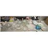 Image 1 : Table top of assorted glassware including - bowls, trays, vase, lids, etc... (approx 25 pieces)