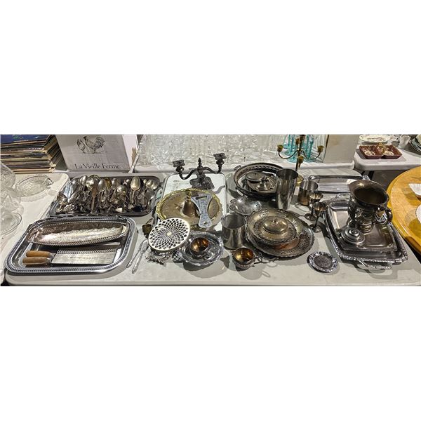 Large table top of silverware including - utensils, butcher knife, serving trays, candle holders, ju