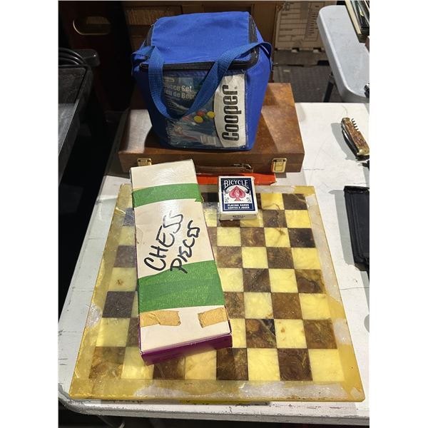 Group lot of chessboard & pieces, bocce set, trivial pursuit, etc...