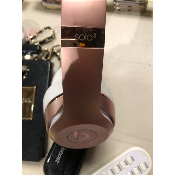Group of misc items including - Beats, wireless headphones, Chanel phone cases, smart watches, etc..