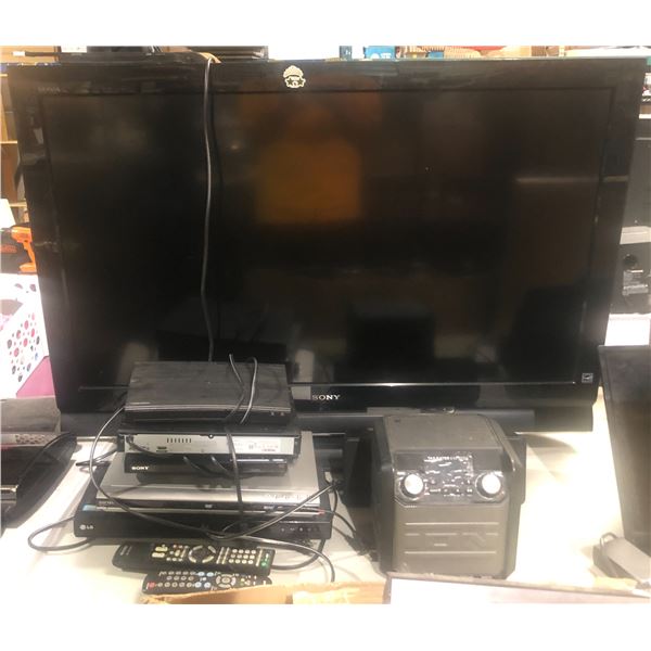 Large group of misc electronics includes - Sony Bravia 46in TV, assorted DVD players, tailgater expr