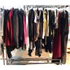 Image 1 : Rack lot full of assorted clothes - includes jackets / dresses / sweaters / jeans / shorts / night g