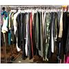 Image 1 : Rack lot full of assorted clothes - includes polo shirts / Reebok long sleeves / dress pants / jeans