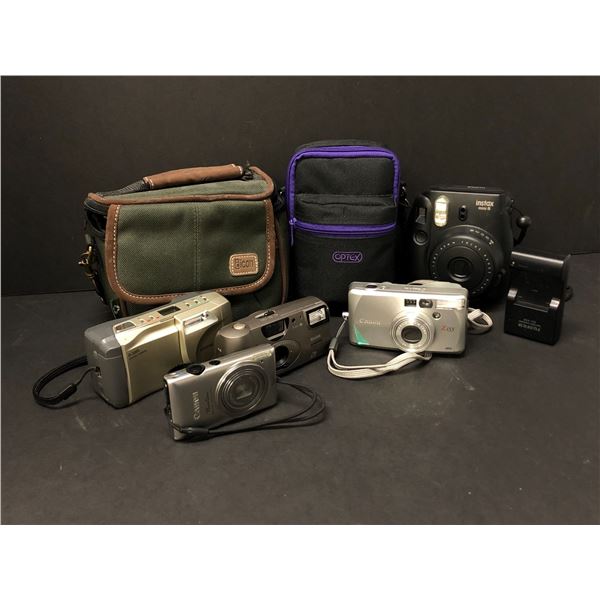 Group of assorted digital cameras - includes Polaroid Instax mini 8 / Cannon Z155 / Kodak Advantix /