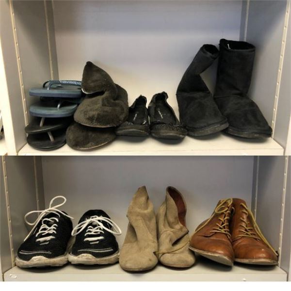 2 shelves full of assorted shoes, boots & sandals