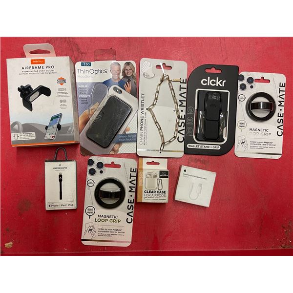 Group of assorted phone accessories - car phone holder/ Apple Lightning to headphone jack adapter/ m