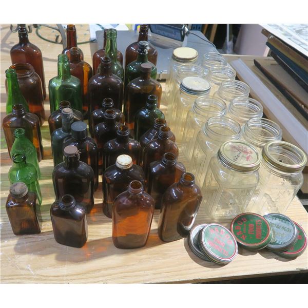 assorted bottles and Nabob jars