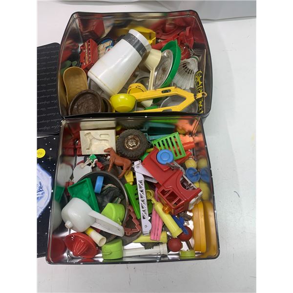 2x tins with toys
