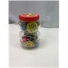 Image 2 : Peanut butter jar filled with pin backs and bottle lids