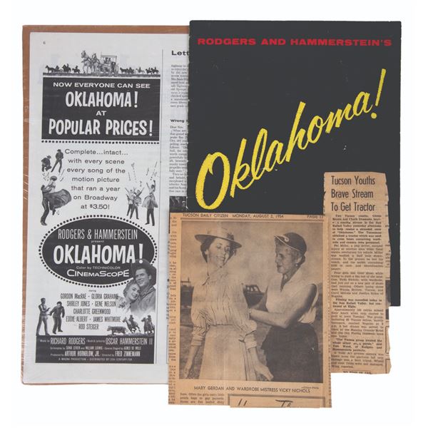 An Oklahoma! Program with newspaper clippings.