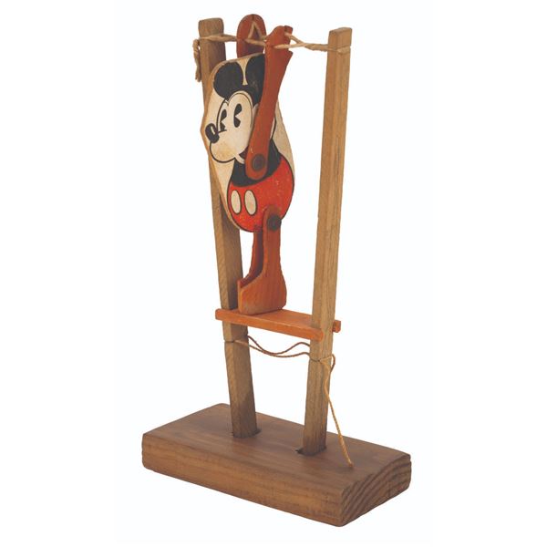 A Mickey Mouse Acrobat Toy.