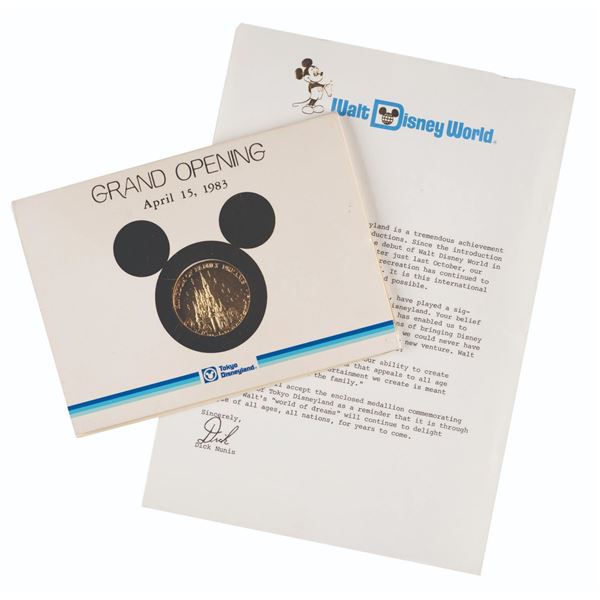 A Tokyo Disneyland Grand Opening Coin & Letter.