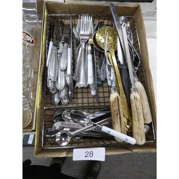 Tray of silverware, serving fork, carving knife,