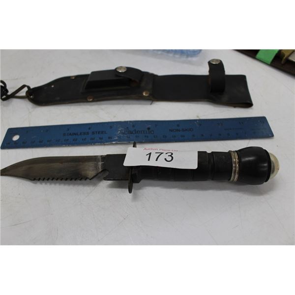 hunting knife in sheath with compass in handle
