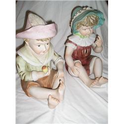 Pair of boy and girl piano babies