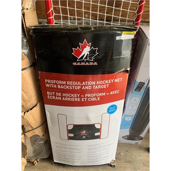 Regulation hockey net with backstop and target