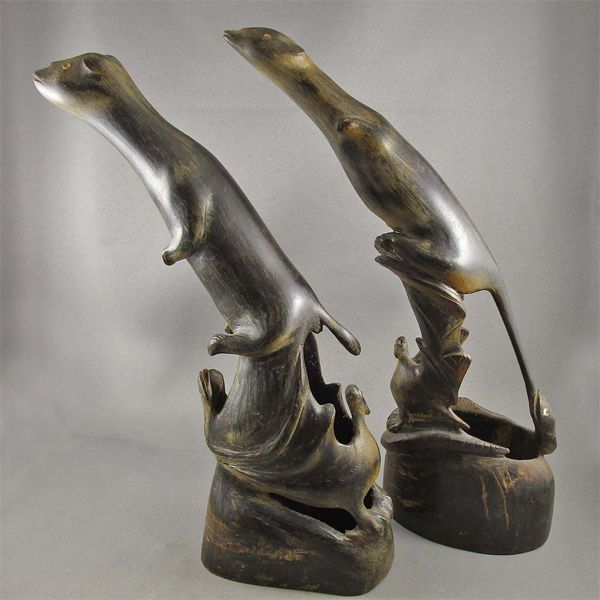 Set of 2 Hand Carved Horn Otters - Marked "Carved by Borneo Native"