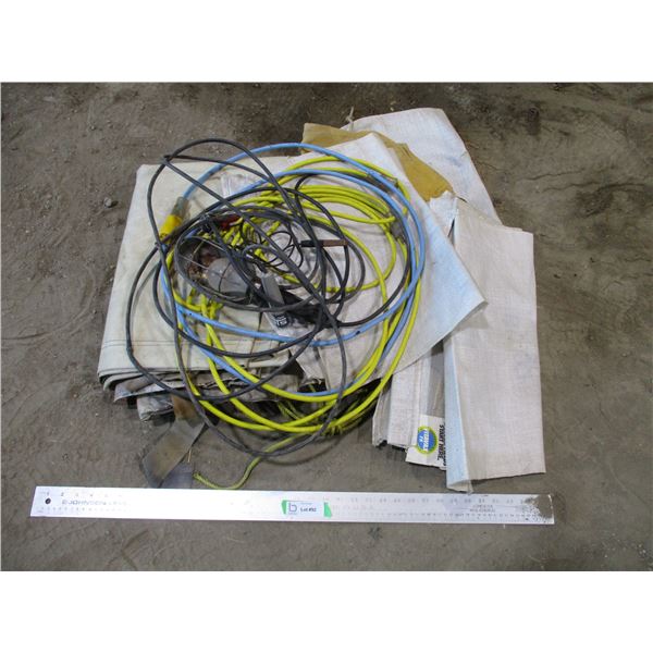 Small Tarp with Seed Bags and Trouble Light, Two Extension Cords