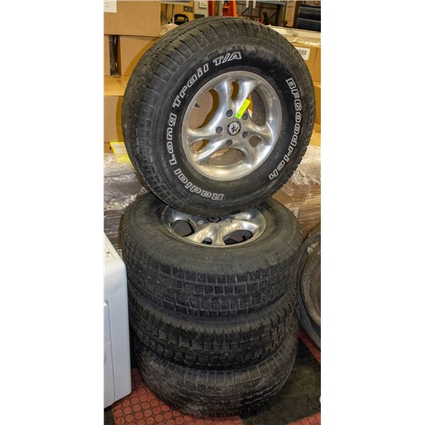 SET OF 4 TIRES ON RIMS 235/75/15