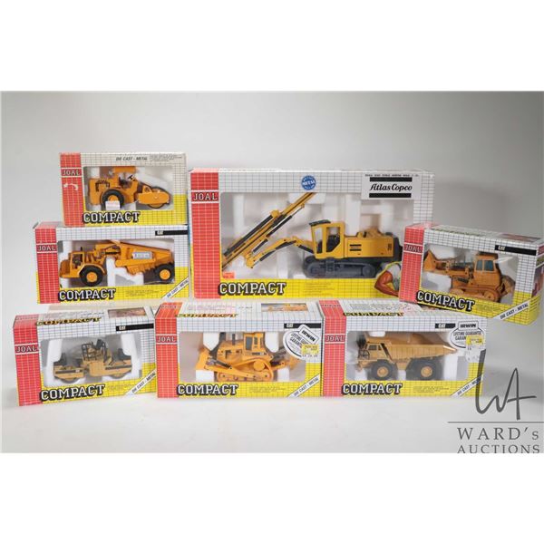 Four Compact by Joal 1:70 scale diecast CAT toys including large dump truck, articulated truck, 955 