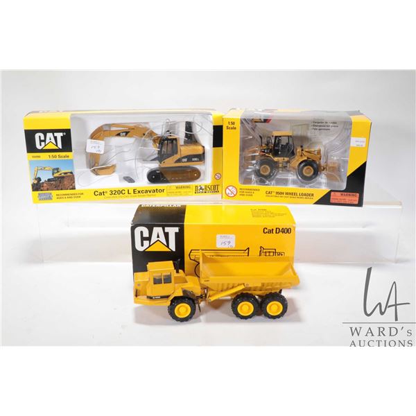 Three 1:50 scale Norscot diecast models including 320CL excavator, D400 articulated truck and 950H w