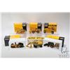 Image 1 : Three 1:50 scale NZG diecast CAT models including 1050 Asphalt paver, 436 back hoe and 215 excavator