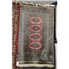 Image 1 : Small wool area carpet with taupe background, multiple medallions and highlights of black, red and o