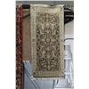 Image 1 : Small wool scatter rug with taupe background, geometric design in overall muted tones, 24" X 49"