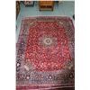 Image 1 : Large 100% handmade Iranian wool carpet "Mashad" with red background, center medallion and overall f