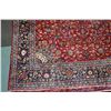 Image 2 : Large 100% handmade Iranian wool carpet "Mashad" with red background, center medallion and overall f