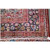 Image 2 : 100% handmade Iranian wool carpet "Mashad" with center medallion, red background, floral design and 