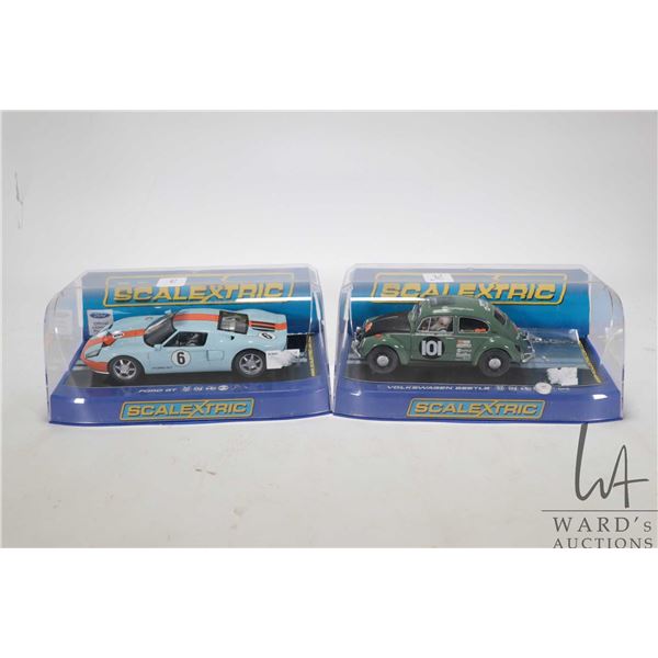 Two boxed 1:32 scale Scalextric slot cars including Ford GT and Volkswagen Beetle