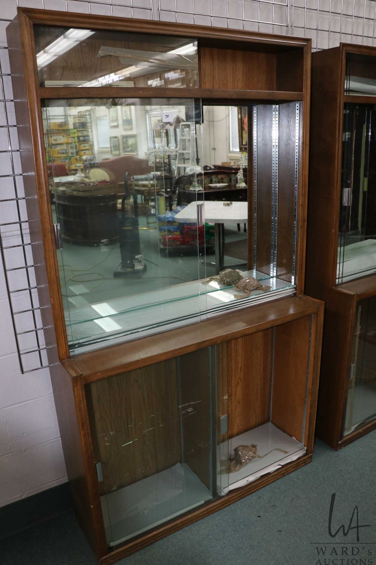 Wood and glass shallow display unit, divided into three parts, each ...