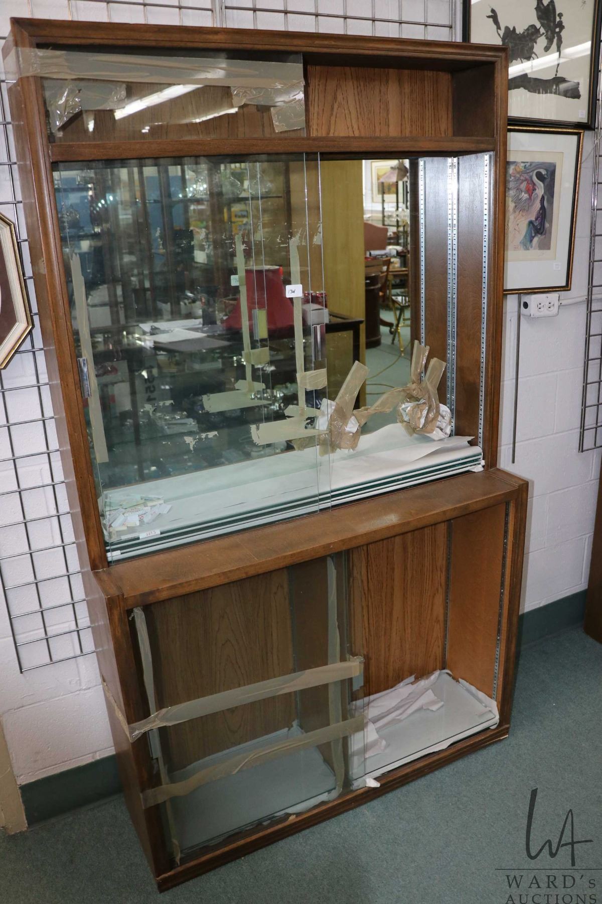 Wood and glass shallow display unit, divided into three parts, each ...