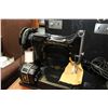 Image 2 : Singer Featherweight portable sewing machine with storage case and accessories, working at time of c