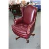 Image 1 : Burgundy upholstered swivel office chair with nail head decoration