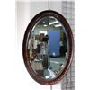 Image 1 : Antique wood framed beveled wall mirror, outside dimension 34" X 24". Note: This lot is not availabl